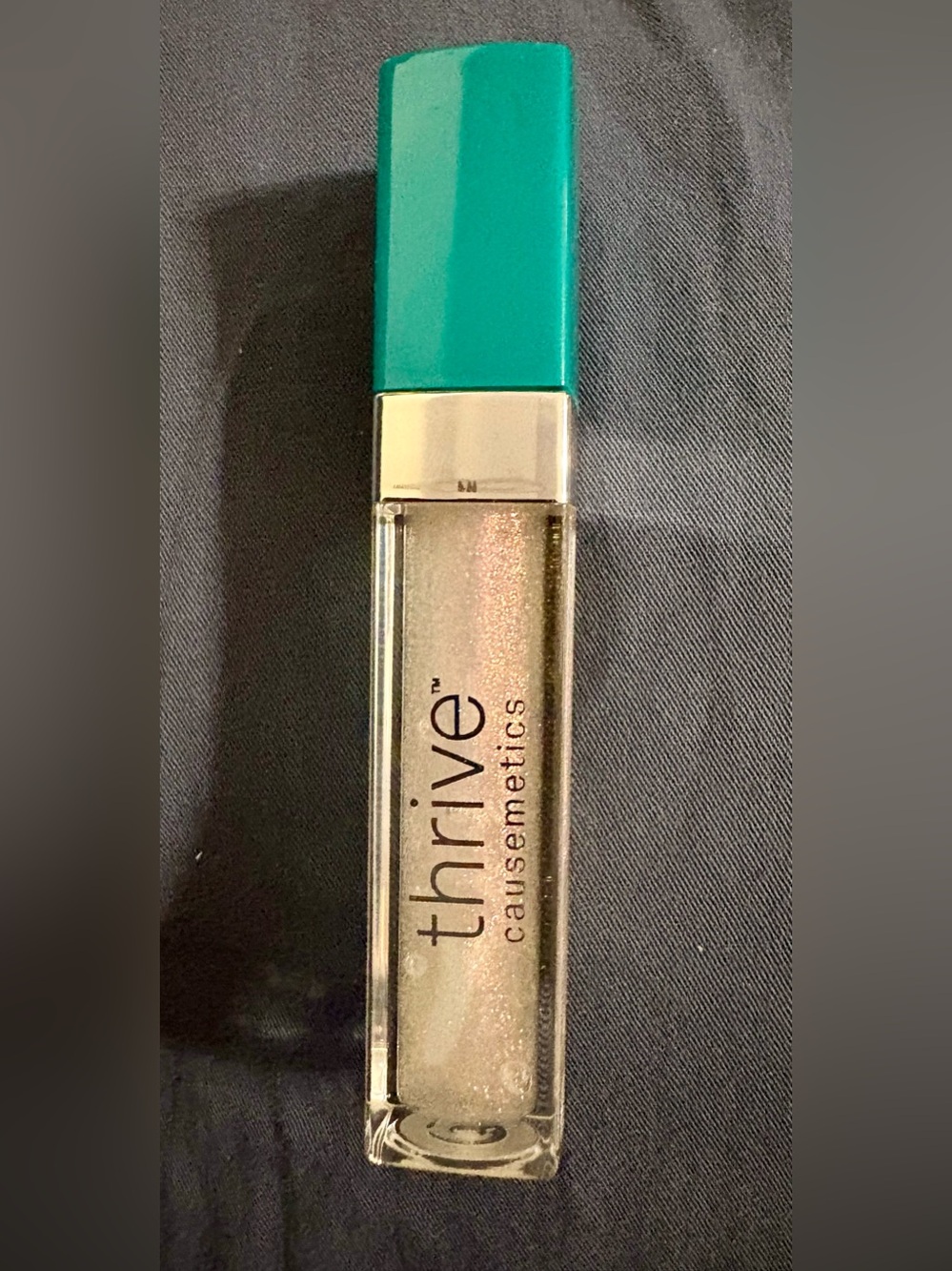 477- NWT- thrive causemetics high shine reviving topper